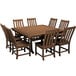 A POLYWOOD teak dining table and chairs around each other.