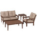 A POLYWOOD Vineyard deep seating set with chairs and small tables on a patio.