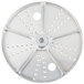 A Waring metal grating / shredding disc with holes in it.