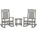 A POLYWOOD slate grey patio set with 2 rocking chairs and a table.
