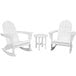 A group of white POLYWOOD Adirondack rocking chairs and a small round table.