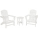 A group of three white POLYWOOD Nautical Adirondack chairs and a round table.
