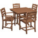 A POLYWOOD teak farmhouse table with four armchairs.