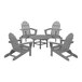 A round table with grey POLYWOOD Adirondack chairs.
