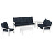 A white and blue POLYWOOD Vineyard deep seating patio set with a table and settee.