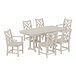 A POLYWOOD Chippendale table and chairs set with white chairs on a patio.