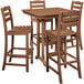 A POLYWOOD teak farmhouse trestle bar table and four chairs.