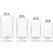 A group of clear 16 oz. ribbed hourglass PET honey bottles with black lids.