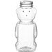 A clear plastic bottle shaped like a bear with a label.