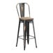 A black metal Lancaster Table & Seating barstool with a gray wood seat.