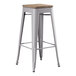 A Lancaster Table & Seating gray metal barstool with a gray wood seat.