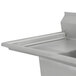 An Advance Tabco stainless steel two compartment pot sink with drainboards on the side.