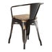 A Lancaster Table & Seating black metal chair with a gray wood seat.