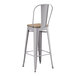 A Lancaster Table & Seating gray metal barstool with a gray wood seat.