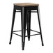 A Lancaster Table & Seating black metal backless counter height stool with a gray wood seat.