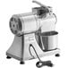 An Estella electric hard cheese grater with a bowl attached.