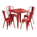 A Lancaster Table & Seating red metal table and chair set with a red square table.