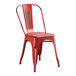 A red metal Lancaster Table & Seating Cafe Chair with a metal back.