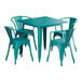 A teal Lancaster Table & Seating outdoor table with four chairs around it.