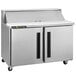 A silver Traulsen refrigerator with two right hinged doors on a refrigerated counter.
