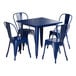 A Lancaster Table & Seating blue metal table and chairs set on an outdoor patio.