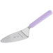 A close-up of a Mercer Culinary pie server with a purple handle.