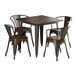 A brown square Lancaster Table & Seating outdoor table with four chairs around it.