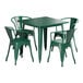 A green square table with four green metal chairs around it.