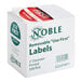 A white box of Noble Products white round removable Use First labels with red and green text.