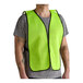 A lime high visibility mesh safety vest worn over a gray t-shirt.