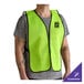 A lime green high visibility mesh safety vest with black trim, worn over a gray t-shirt.