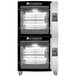 A large black and silver Rotisol-France electric rotisserie oven with racks on top.