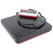 A black Rubbermaid electronic receiving scale with a cord.