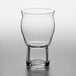 A close-up of a clear Rastal Craft Master Grand beer glass with a short leg.