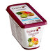 A container of fruit yogurt with Les Vergers Boiron Tropical Fruits 100% Fruit Puree on top.