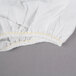 a white cloth with yellow thread