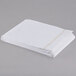 A folded white Oxford T180 Superblend flat sheet with yellow stitching.