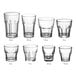 A group of clear Acopa Memphis Rocks glasses with curved edges and textured bottoms.