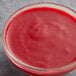 A bowl of Les Vergers Boiron Red Raspberry fruit puree.