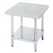 An Advance Tabco stainless steel mixer table with a shelf.