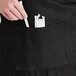 a person putting straws in a pocket