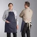 a man wearing a blue apron