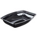 A black plastic container with a curved edge.