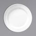 A Libbey Basics bright white melamine plate with a medium rim.