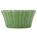 A CAC Festiware green china ramekin with a scalloped edge.