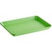 A Baker's Mark green rectangular aluminum sheet pan with a wire in rim.