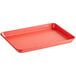 a red rectangular tray with handles