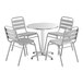 A Lancaster Table & Seating chrome table with 4 chairs around it.