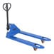 A blue Vestil hand pallet truck with wheels and handles.