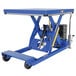 A blue Vestil battery-powered lift table with wheels.